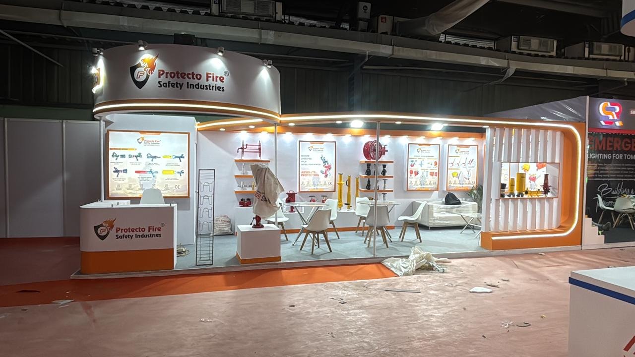 Protecto Fire Safety Industries exhibition stall with backlit product panels and display shelves